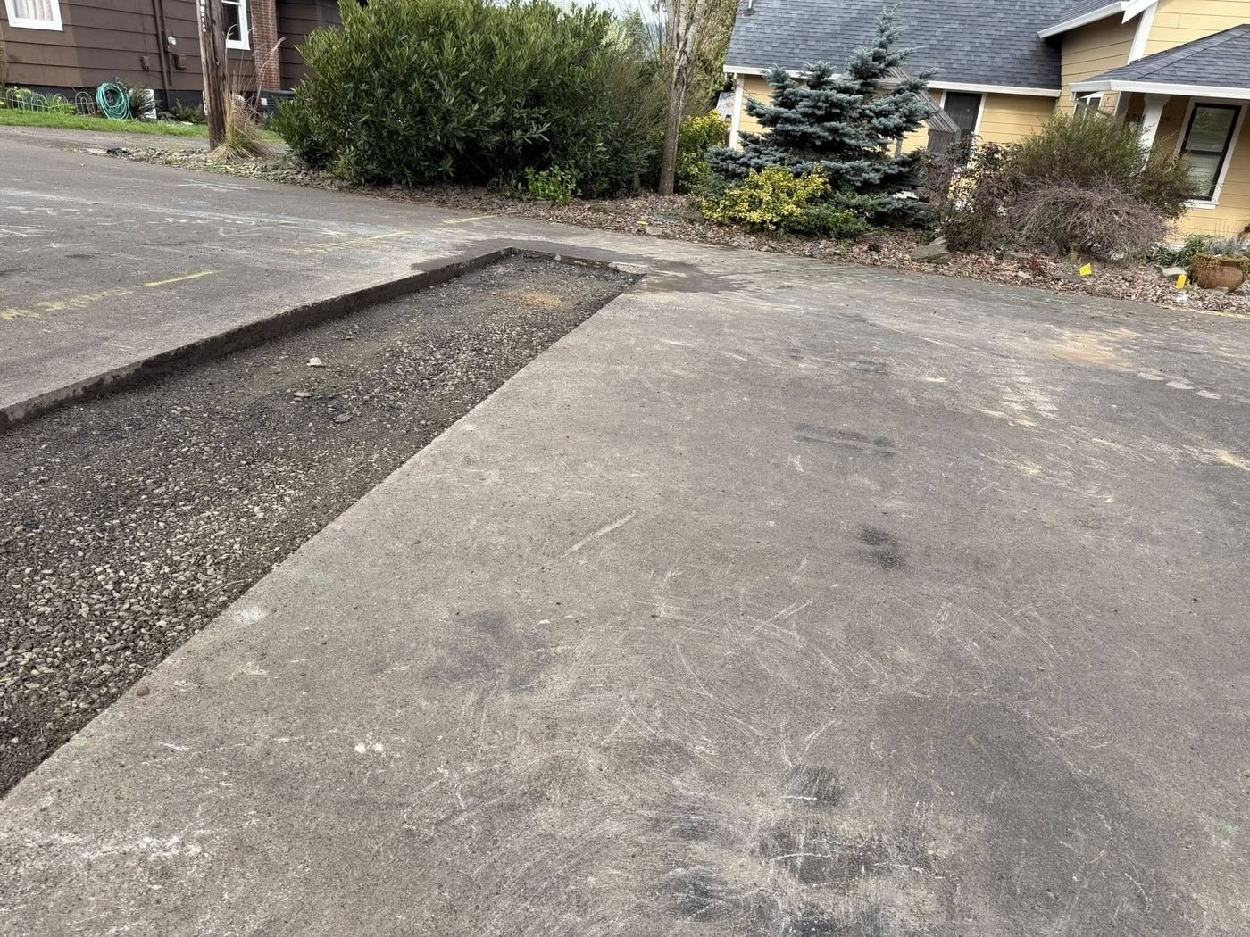 Before: Worn and damaged driveway