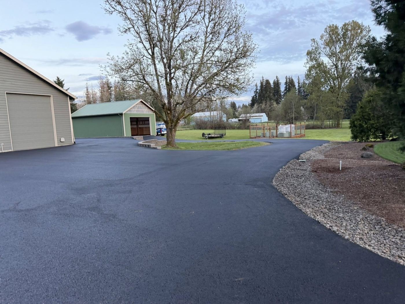 Before: Faded asphalt driveway before sealcoating